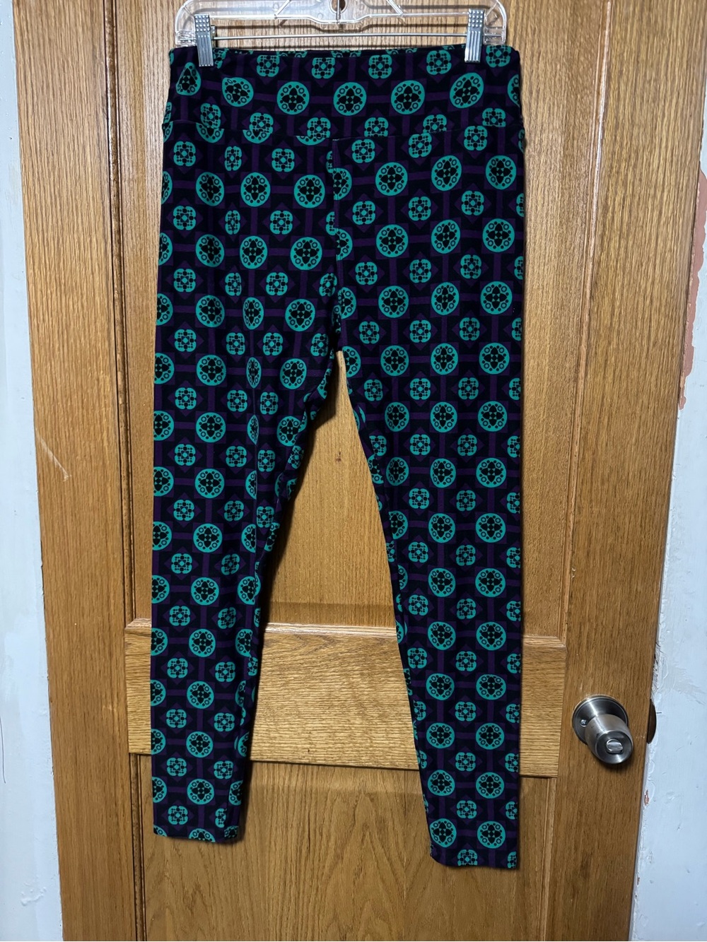 LuLaRoe Black Leggings with Teal Circular Medallion Print